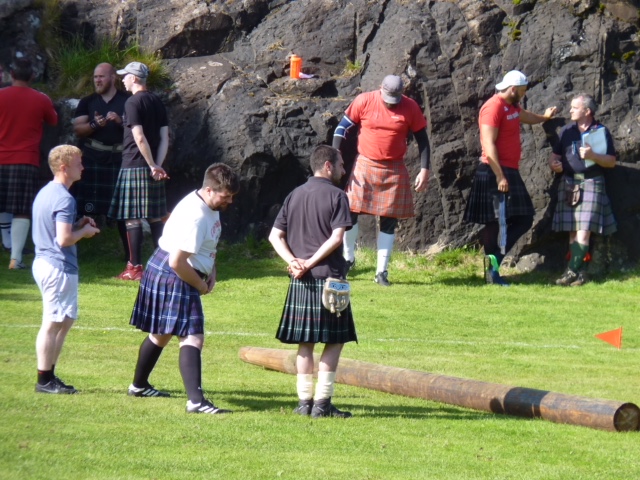 Tossing the caber (or considering it) at the Skye Highland Games